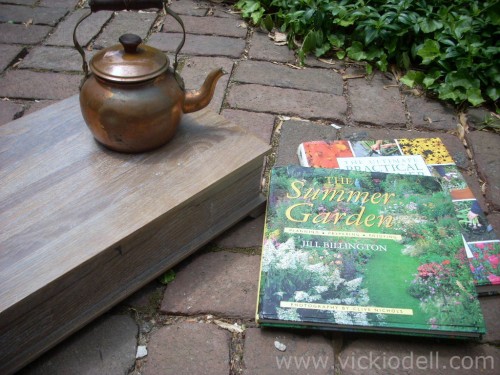 Vintage silver box, tea kettle and gardening books