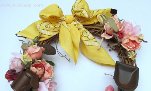 Yellow bandana bow on a grapevine wreath